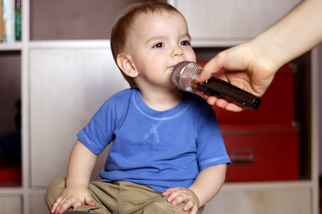 Photo of baby with a microphone